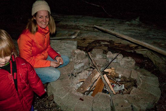 Kristen prepares the fire